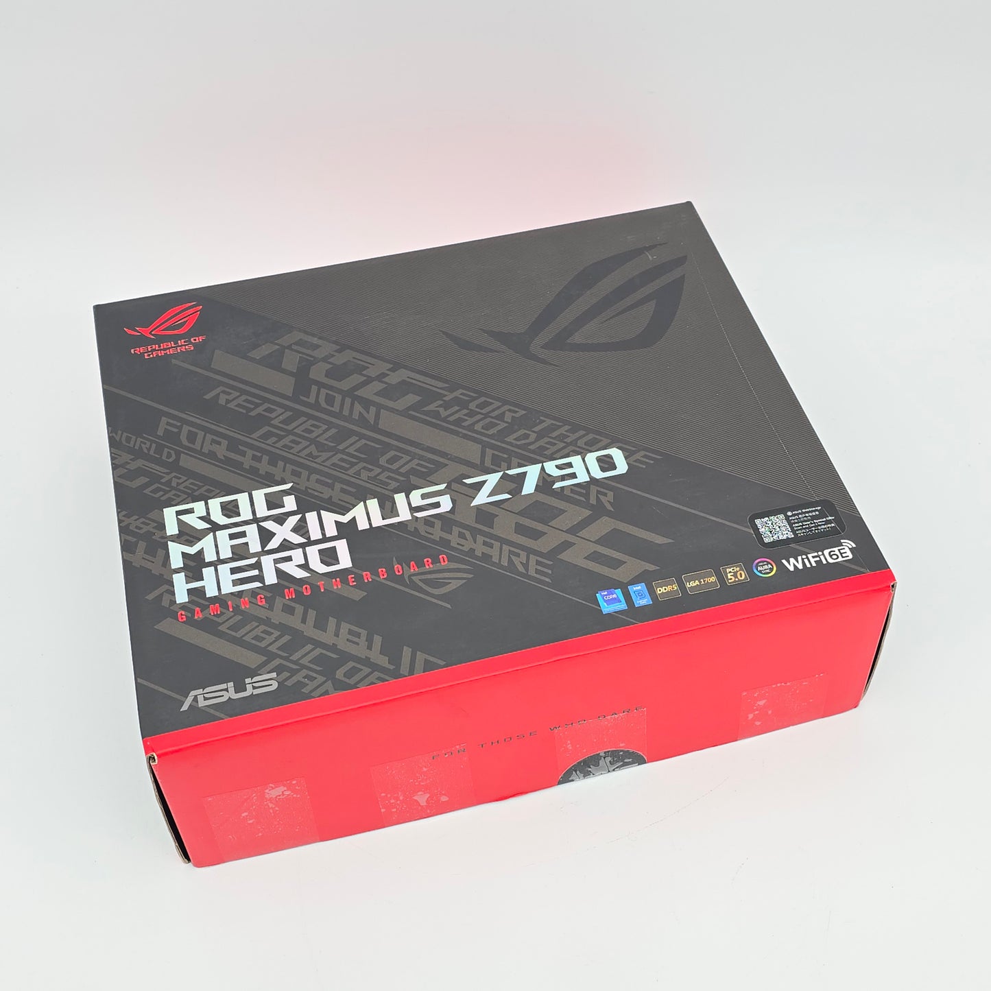 Gaming laptop box with ASUS ROG branding on a light gray background
