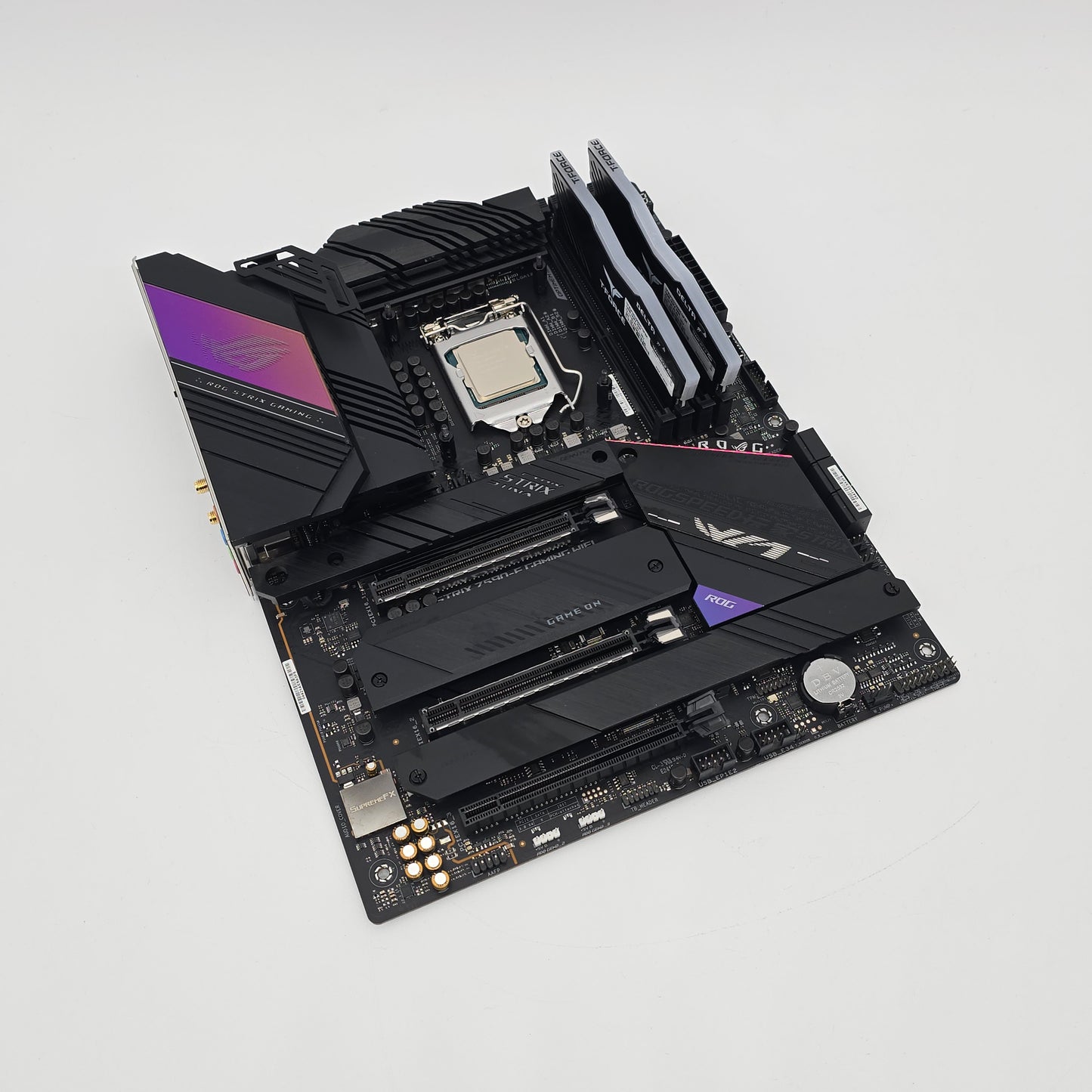 Computer motherboard with ASUS logo on a light gray background