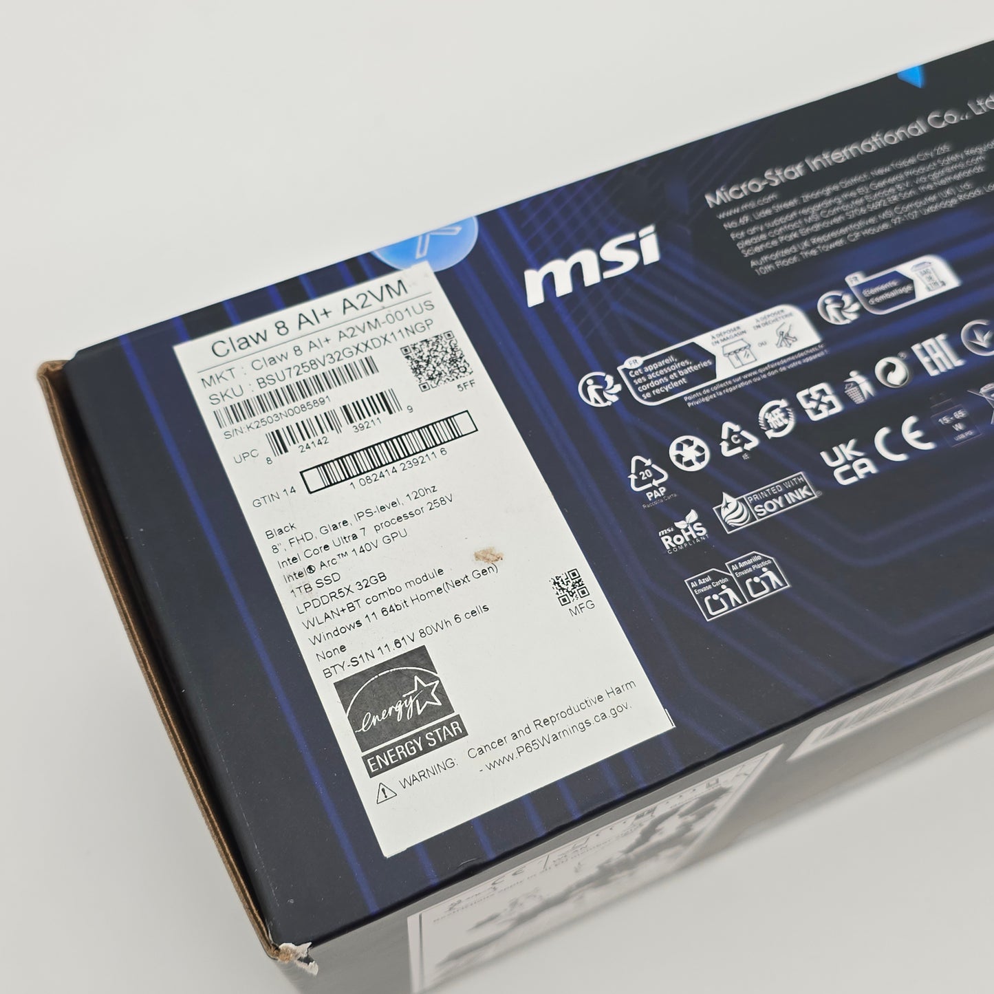 Back view of an MSI computer case packaging with branding and product details.
