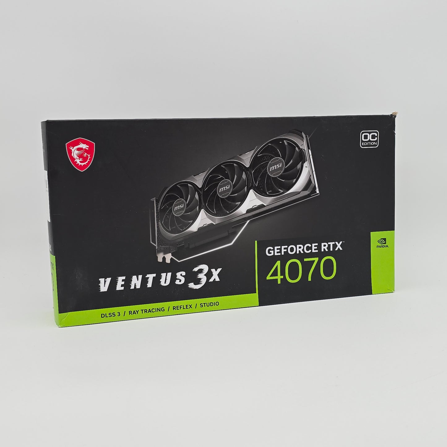 MSI GeForce RTX 4070 VENTUS 3X graphics card packaging on a gray background