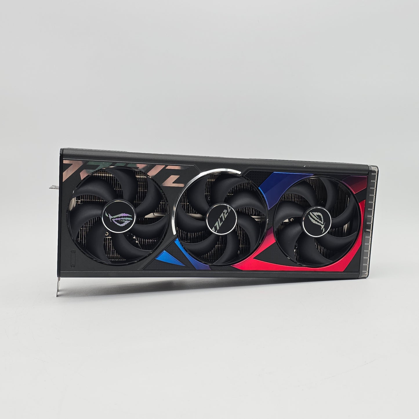 Gaming graphics card with three fans on a gray background