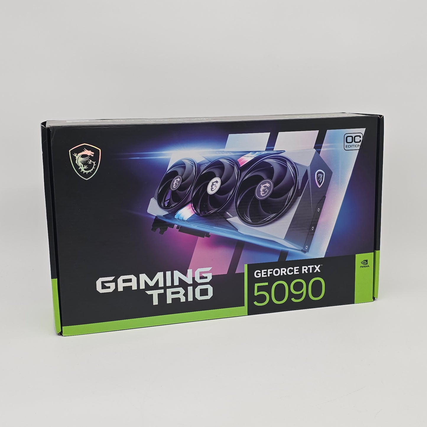 NVIDIA GeForce RTX 5090 GAMING TRIO graphics card packaging on a white background