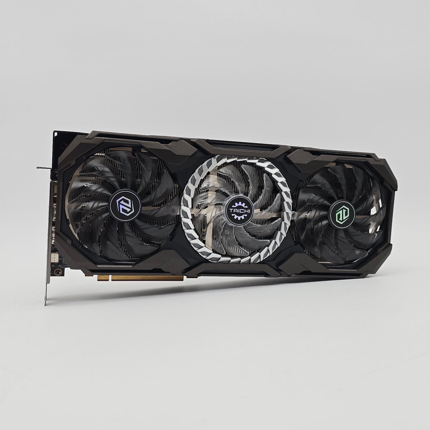 Computer graphics card with three fans on a gray background asrock taichi oc 6800xt for gaming pc