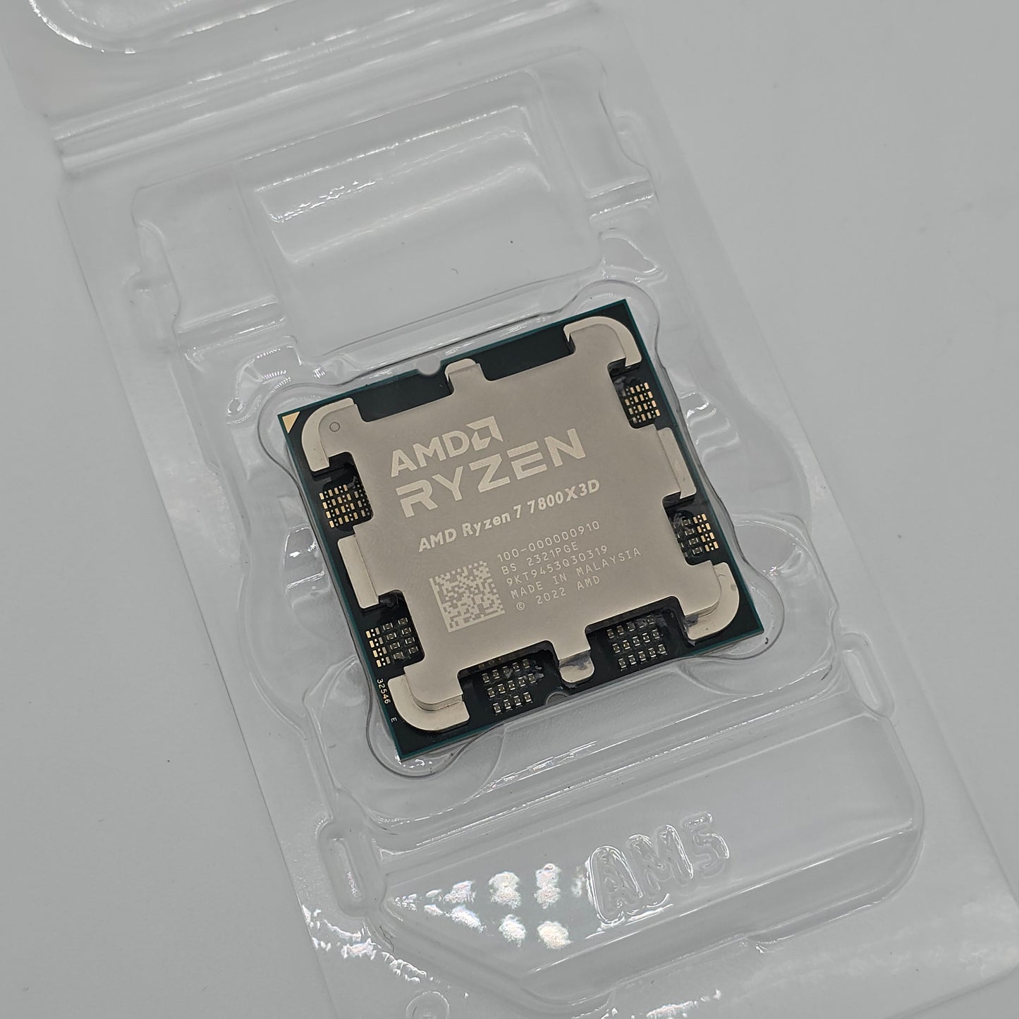 An AMD Ryzen 7 7800X3D CPU in its original packaging.