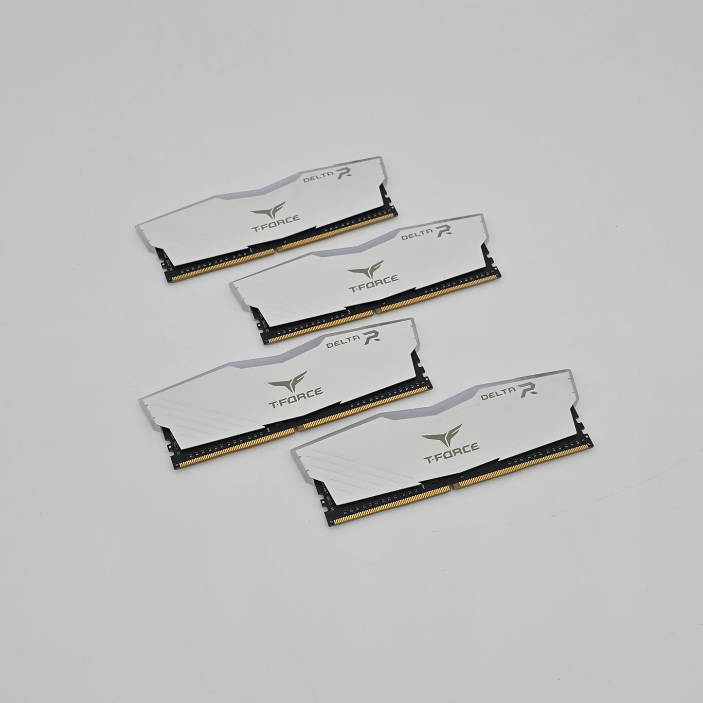 Four T-Force memory sticks on a light gray background