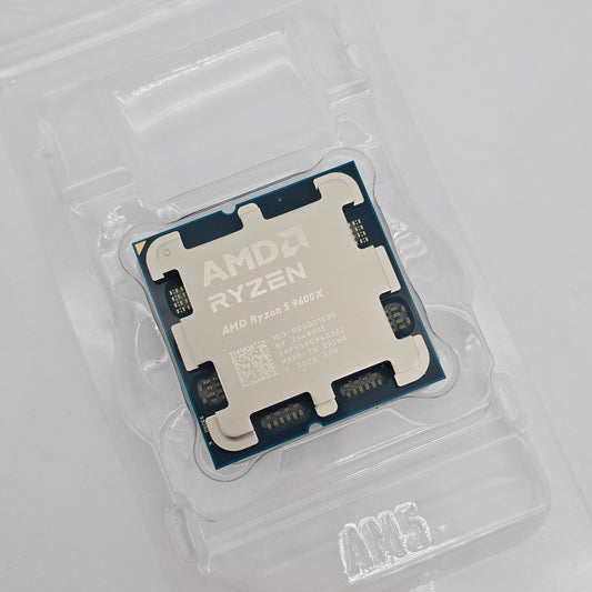 AMD Ryzen CPU in clear plastic packaging on a light gray background