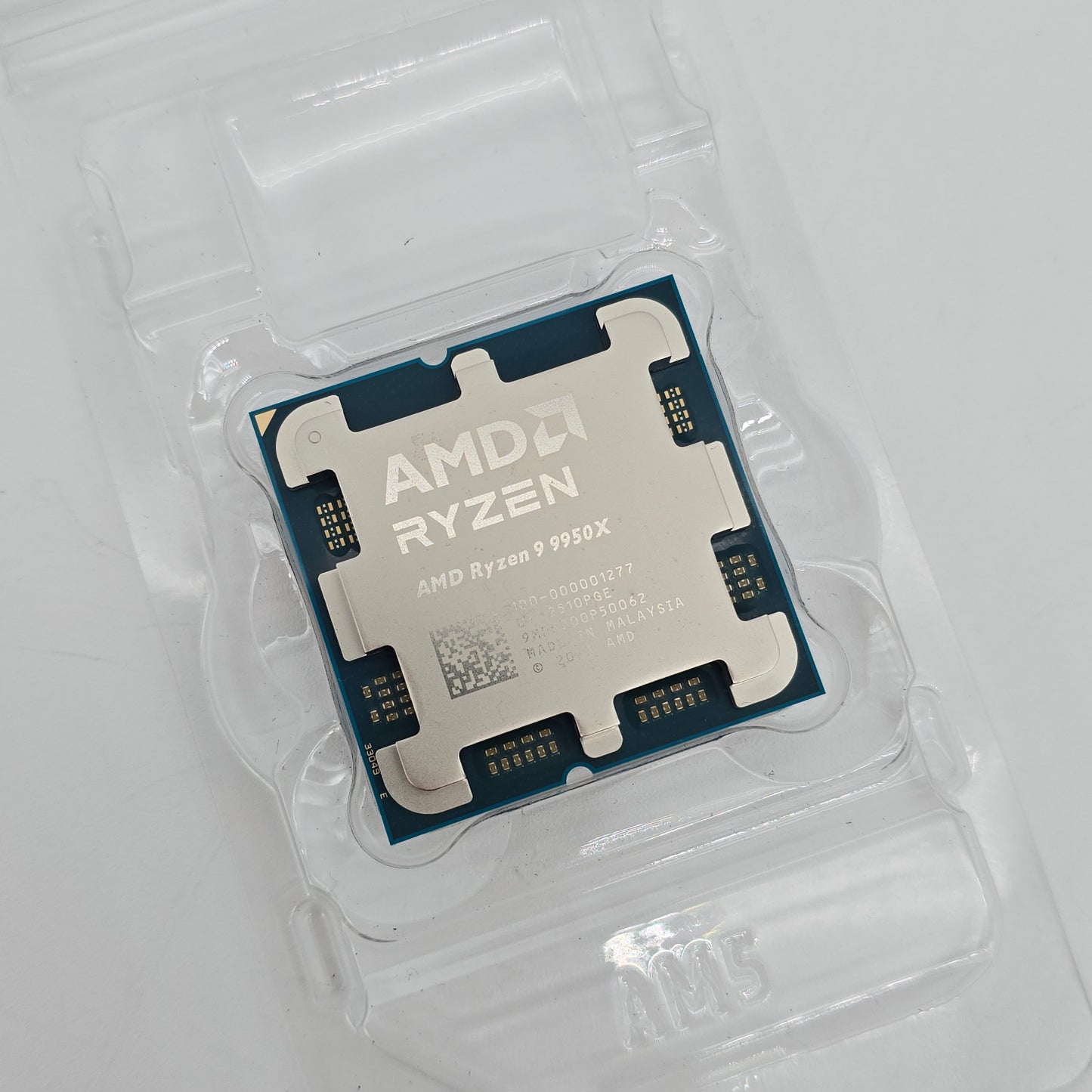 AMD Ryzen CPU in clear packaging on a white background
