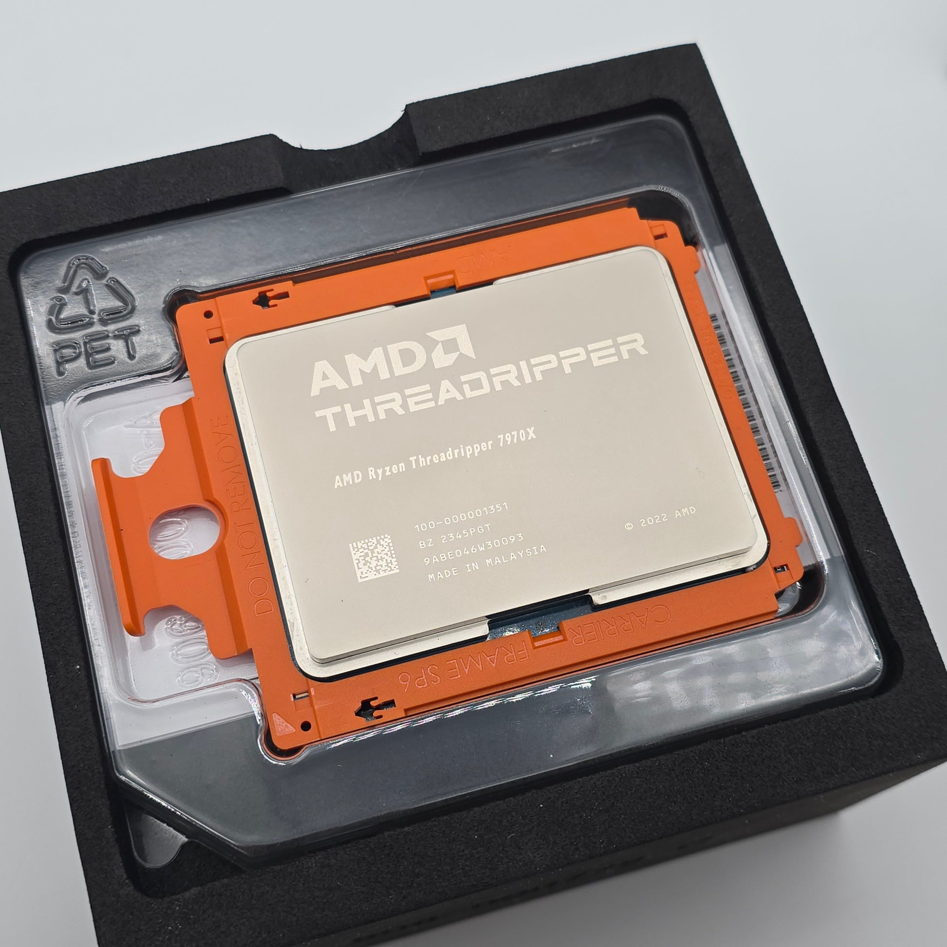 AMD Threadripper CPU in packaging on a light gray background