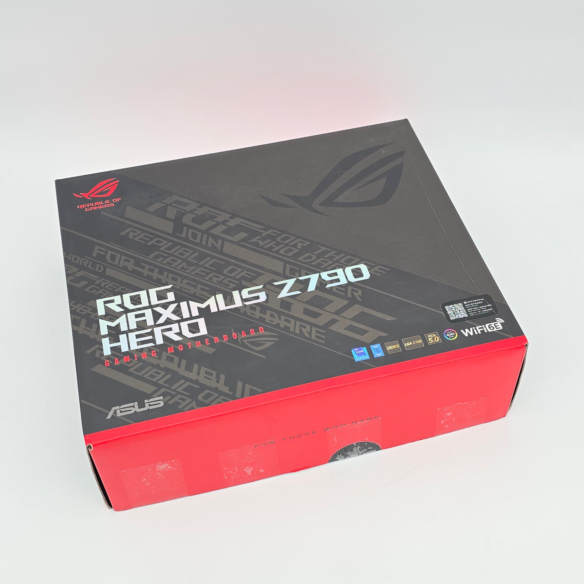 Gaming laptop box with ASUS ROG branding on a light gray background