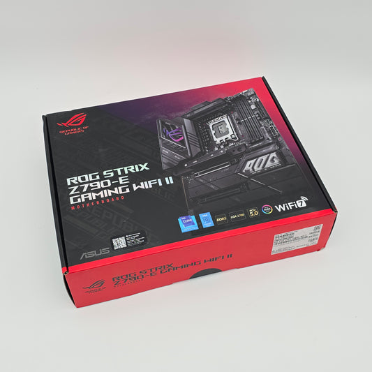 Computer motherboard packaging with ASUS ROG branding on a light gray background