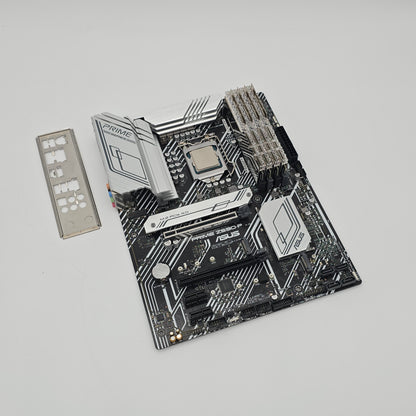 Computer motherboard with CPU socket on a gray background