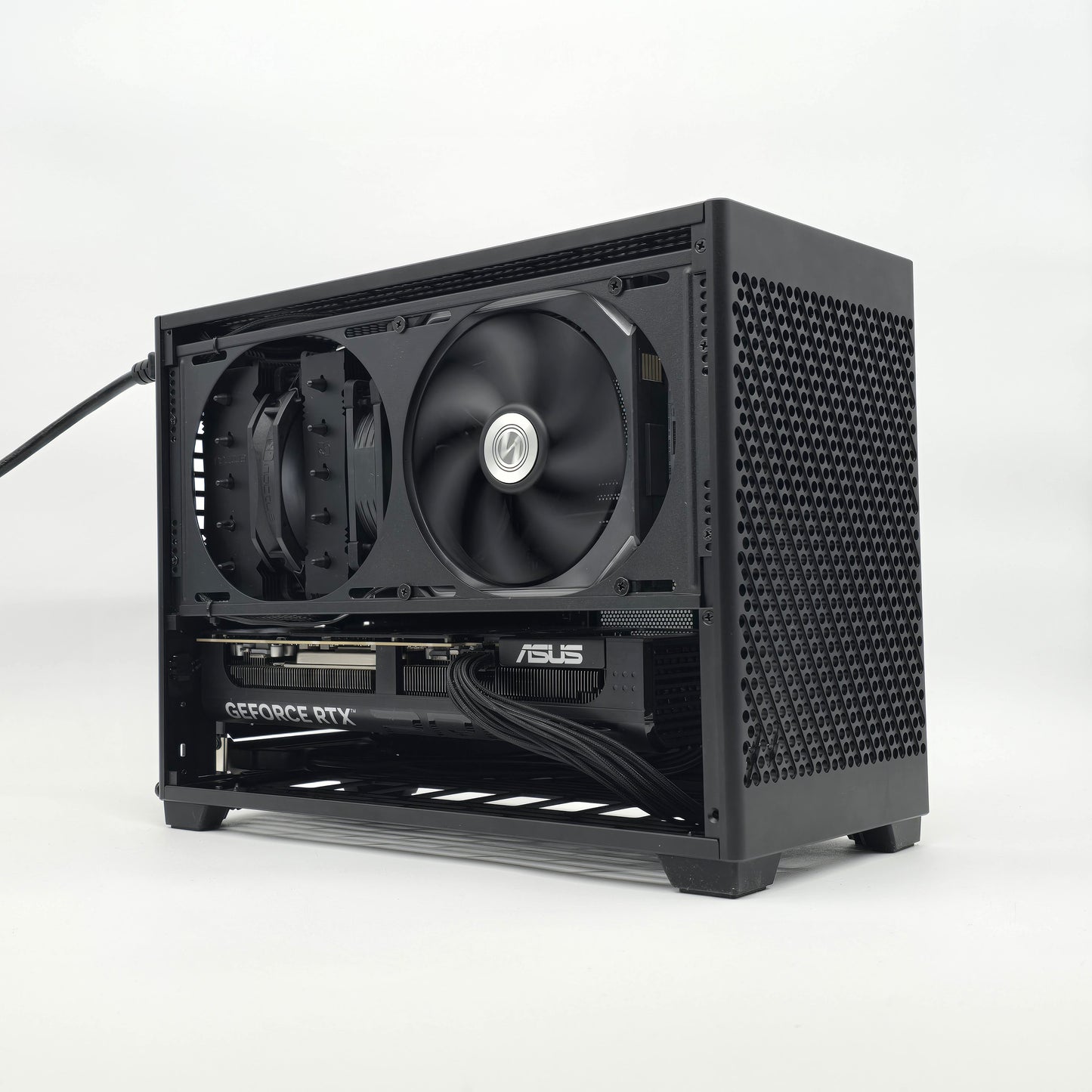 Black computer case with two fans on a white background, case is an NCASE M2 model, graphics card is an NVIDIA RTX 5080 ASUS PRIME OC model