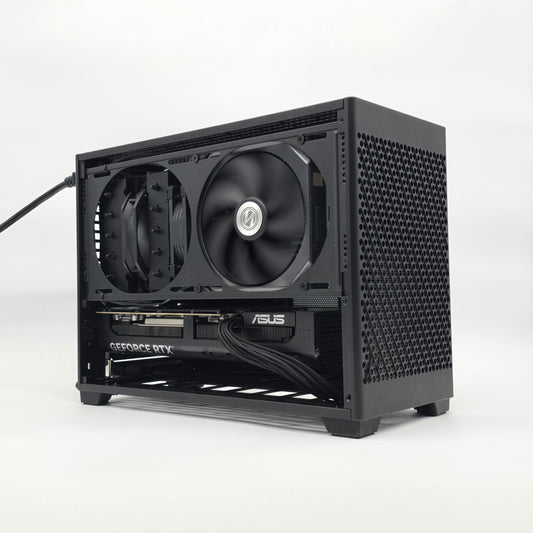 Black computer case with two fans on a white background, case is an NCASE M2 model, graphics card is an NVIDIA RTX 5080 ASUS PRIME OC model
