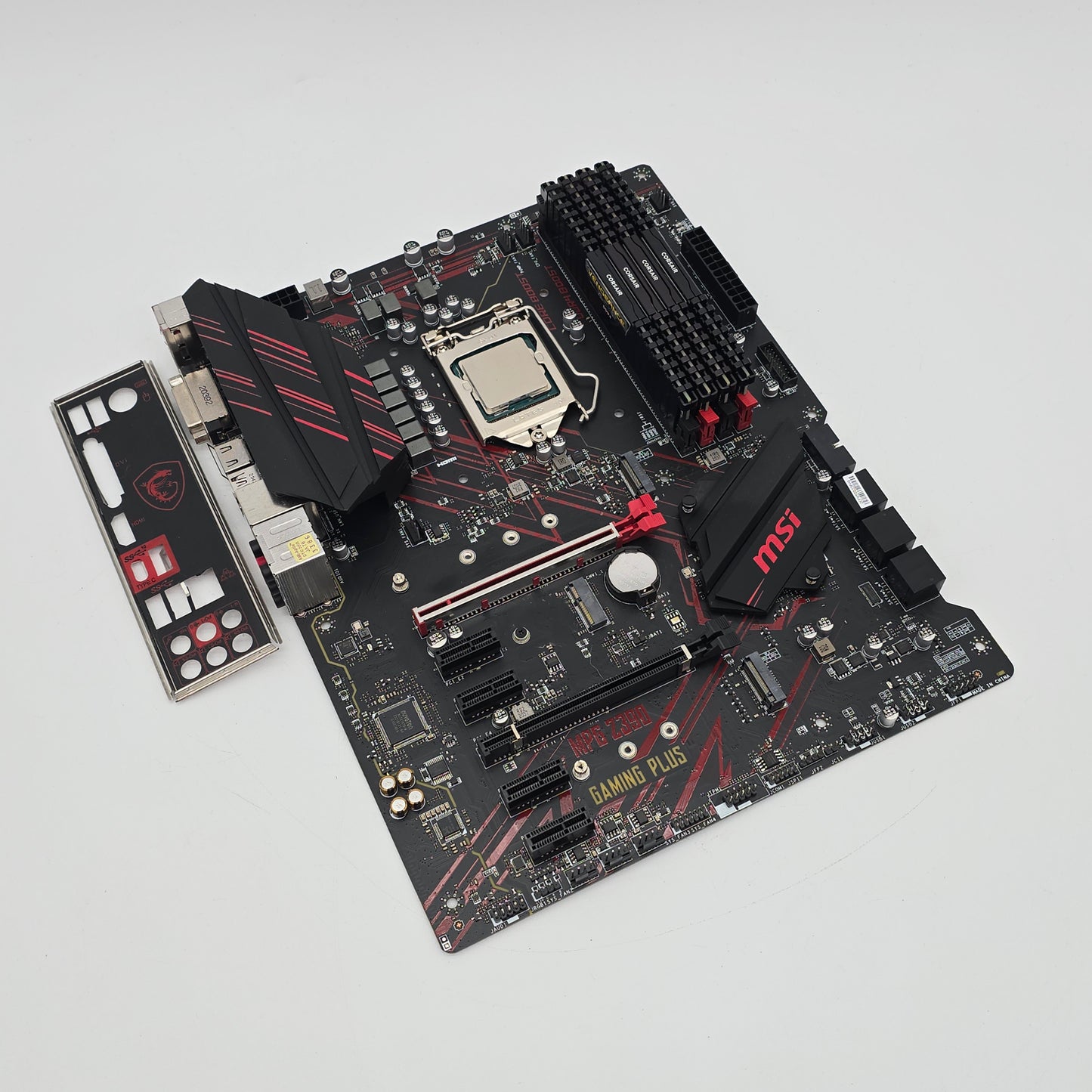 Computer motherboard with visible branding on a light gray background