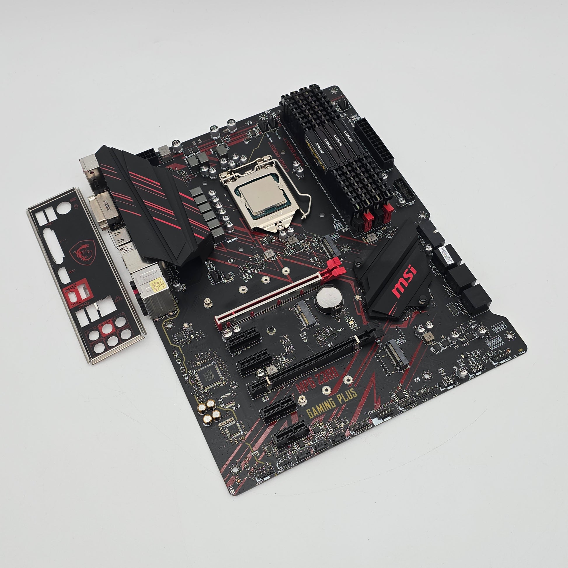 Computer motherboard with visible branding on a light gray background