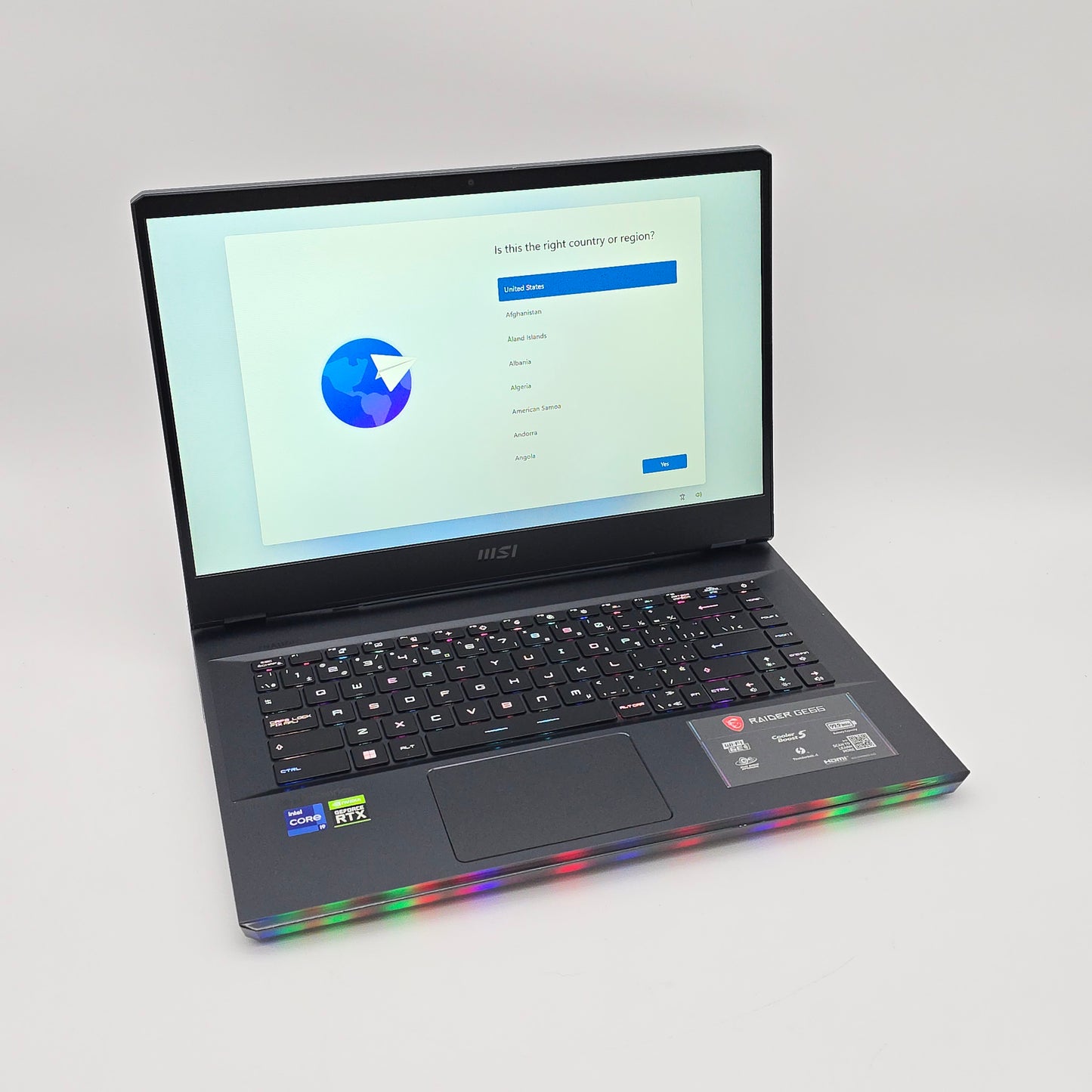 Laptop with colorful LED lights on a gray background