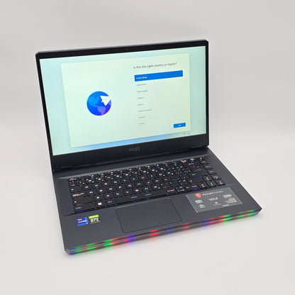 Laptop with colorful LED lights on a gray background