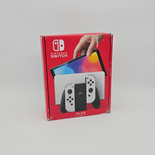Red Nintendo Switch OLED packaging with a hand holding the console on a gray background
