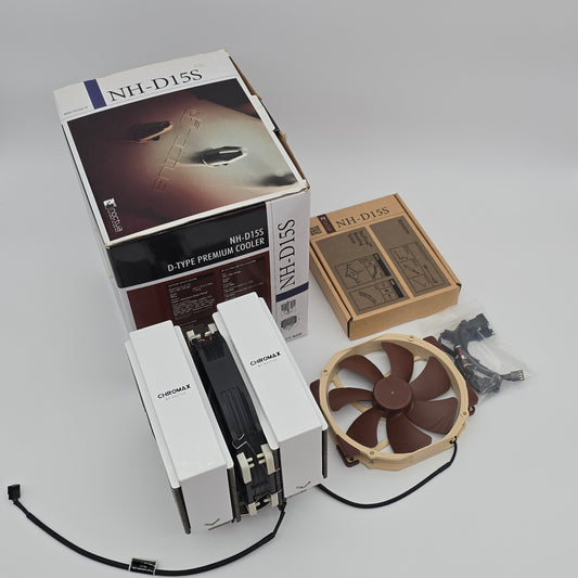 Computer cooling system components including a fan and heat sink on a gray background