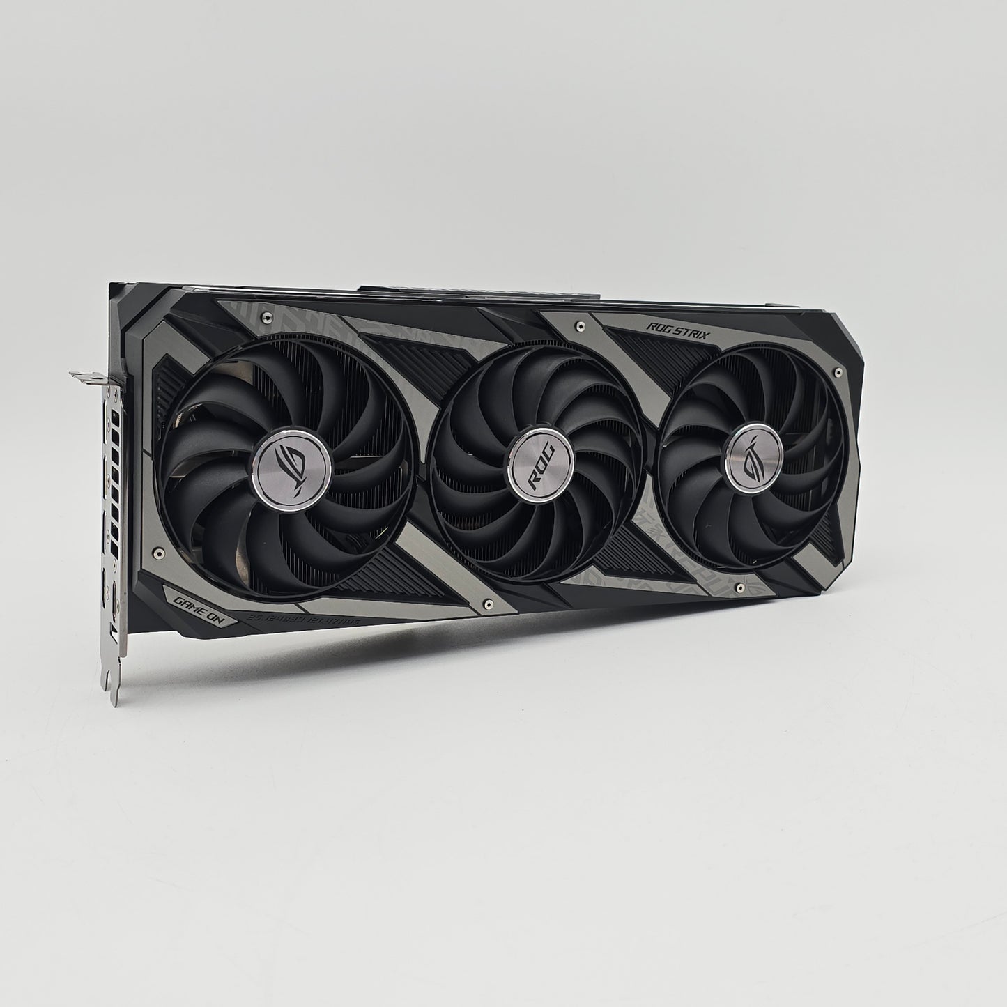 Graphics card with three fans on a gray background