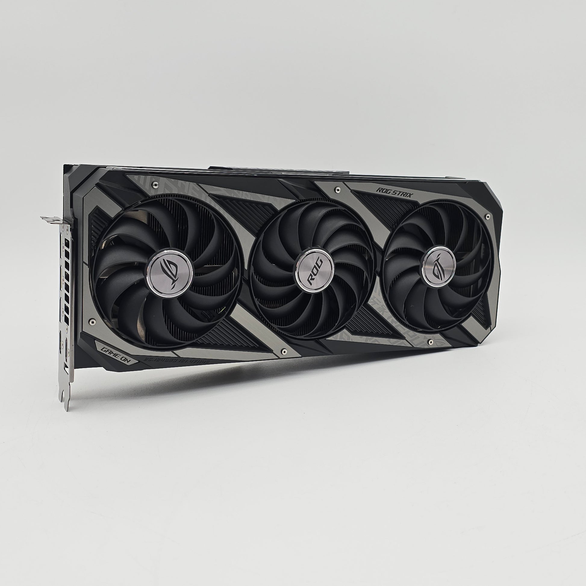 Graphics card with three fans on a gray background