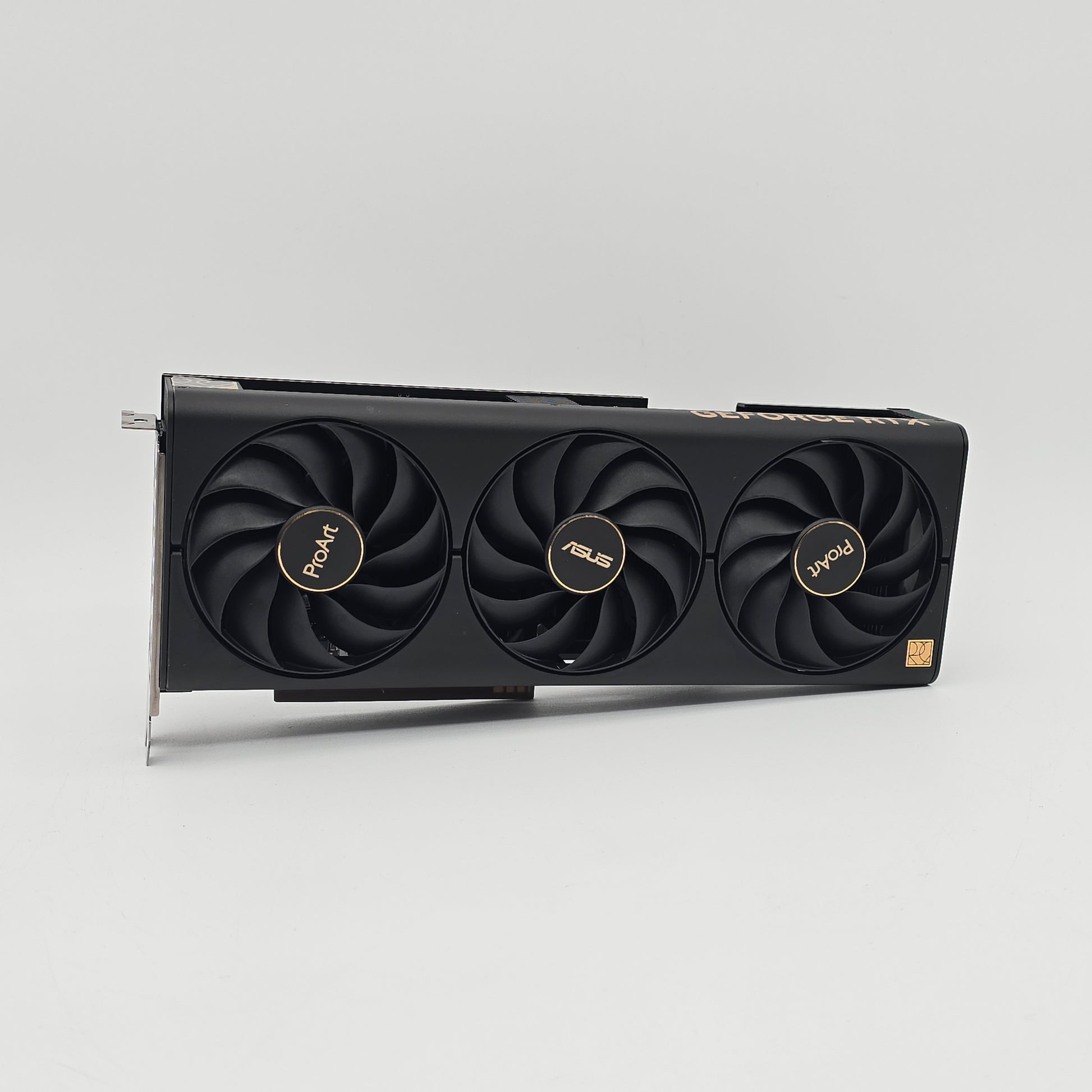 Computer graphics card with three fans on a gray background