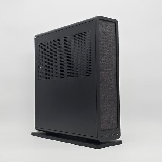 Black computer case on a white background, case is a fractal design ridge with an rtx 4080 super by nvidia inside