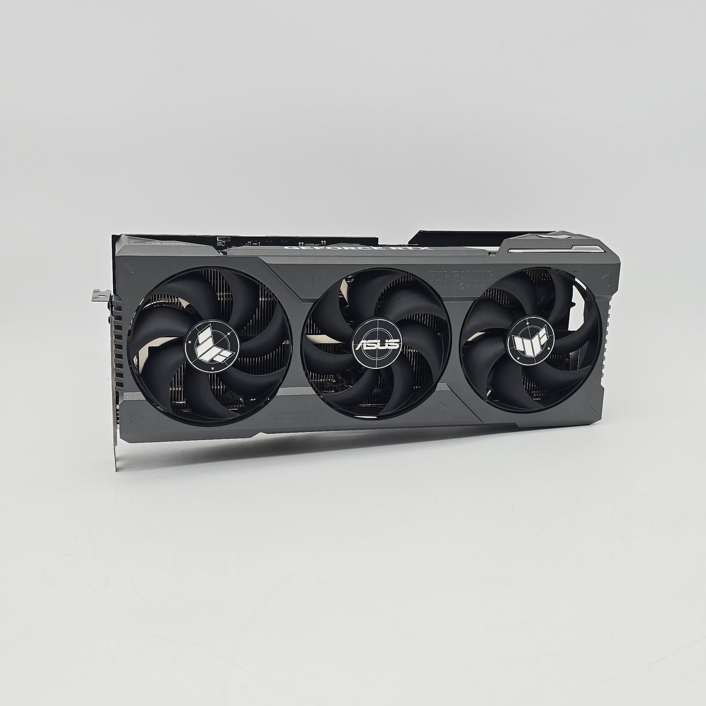 Asus graphics card with three fans on a gray background