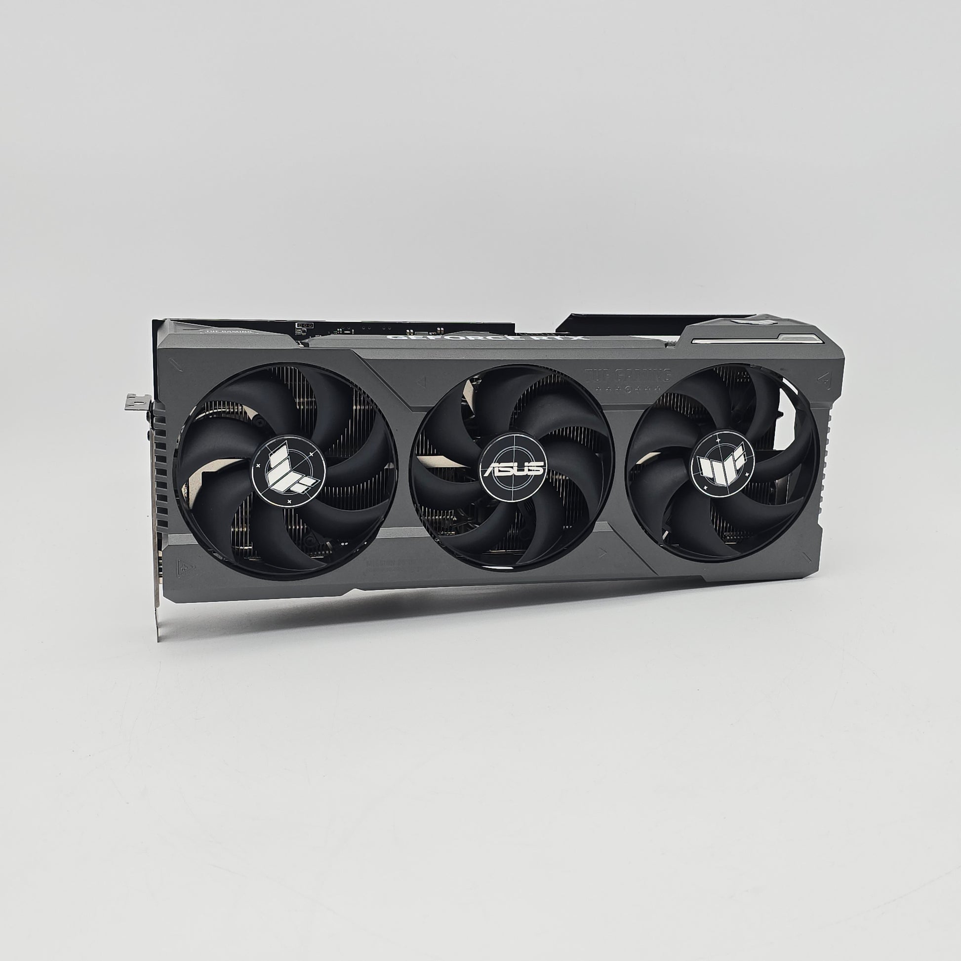 Asus graphics card with three fans on a gray background