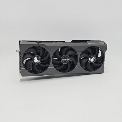 Asus graphics card with three fans on a gray background