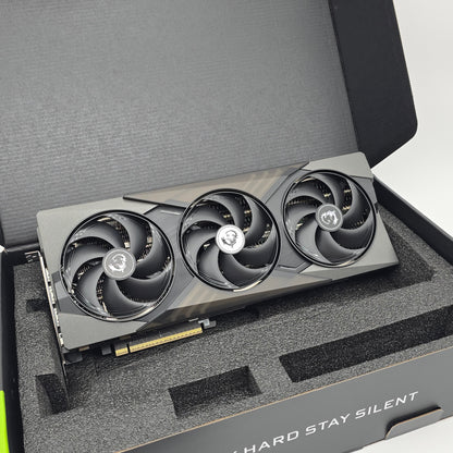 Gaming graphics card with three fans in a protective foam tray.