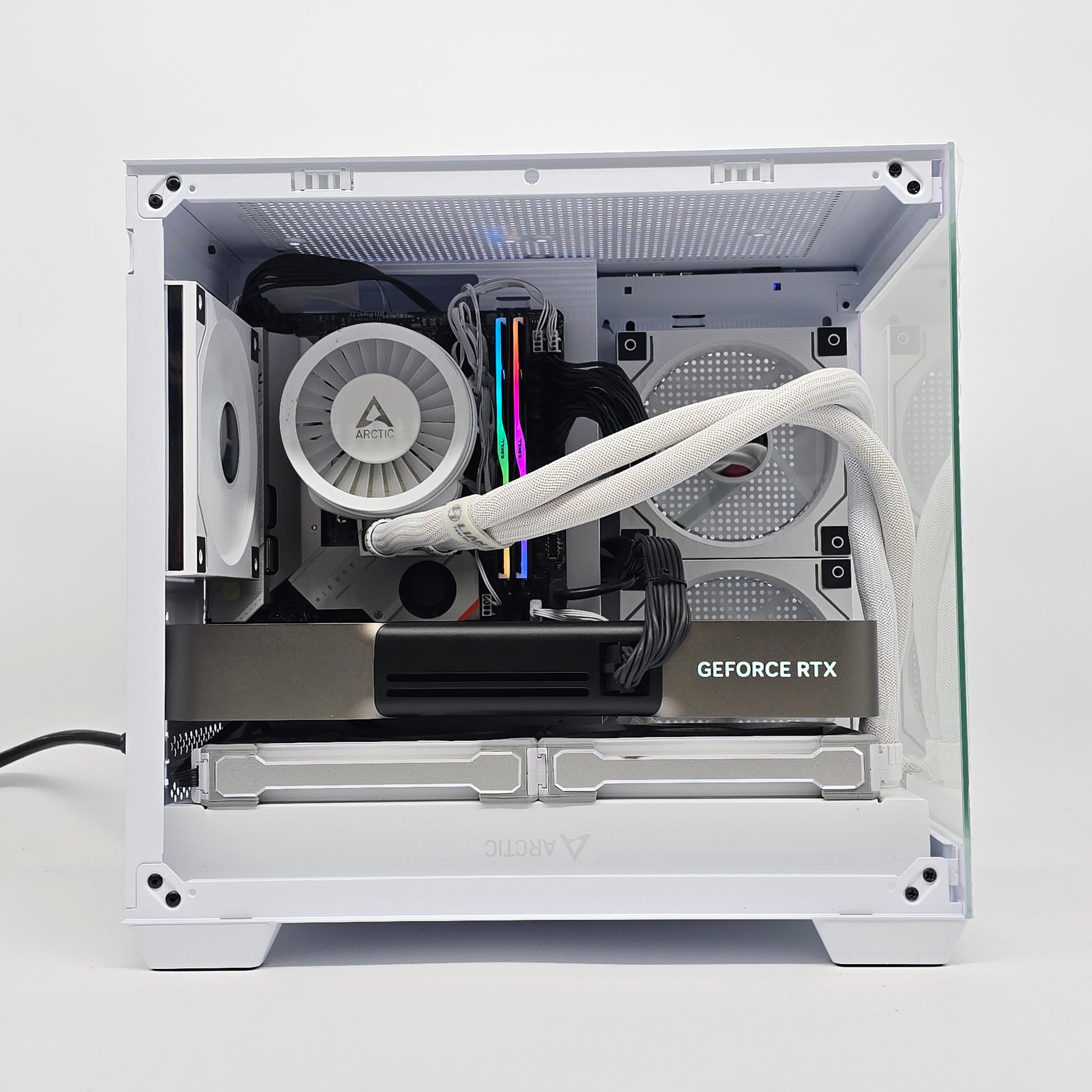 Open computer case with visible components on a white background