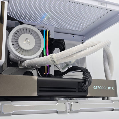 Close-up of a computer graphics card with a white radiator and visible brand name.