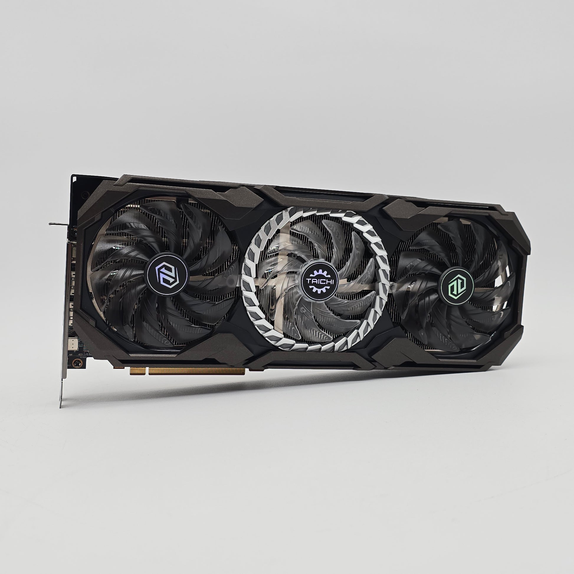 Computer graphics card with three fans on a gray background asrock taichi oc 6800xt for gaming pc